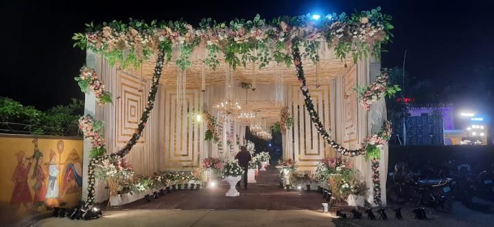 Elegant floral entrance gate decoration with fairy lights by Mayur Events Bilaspur